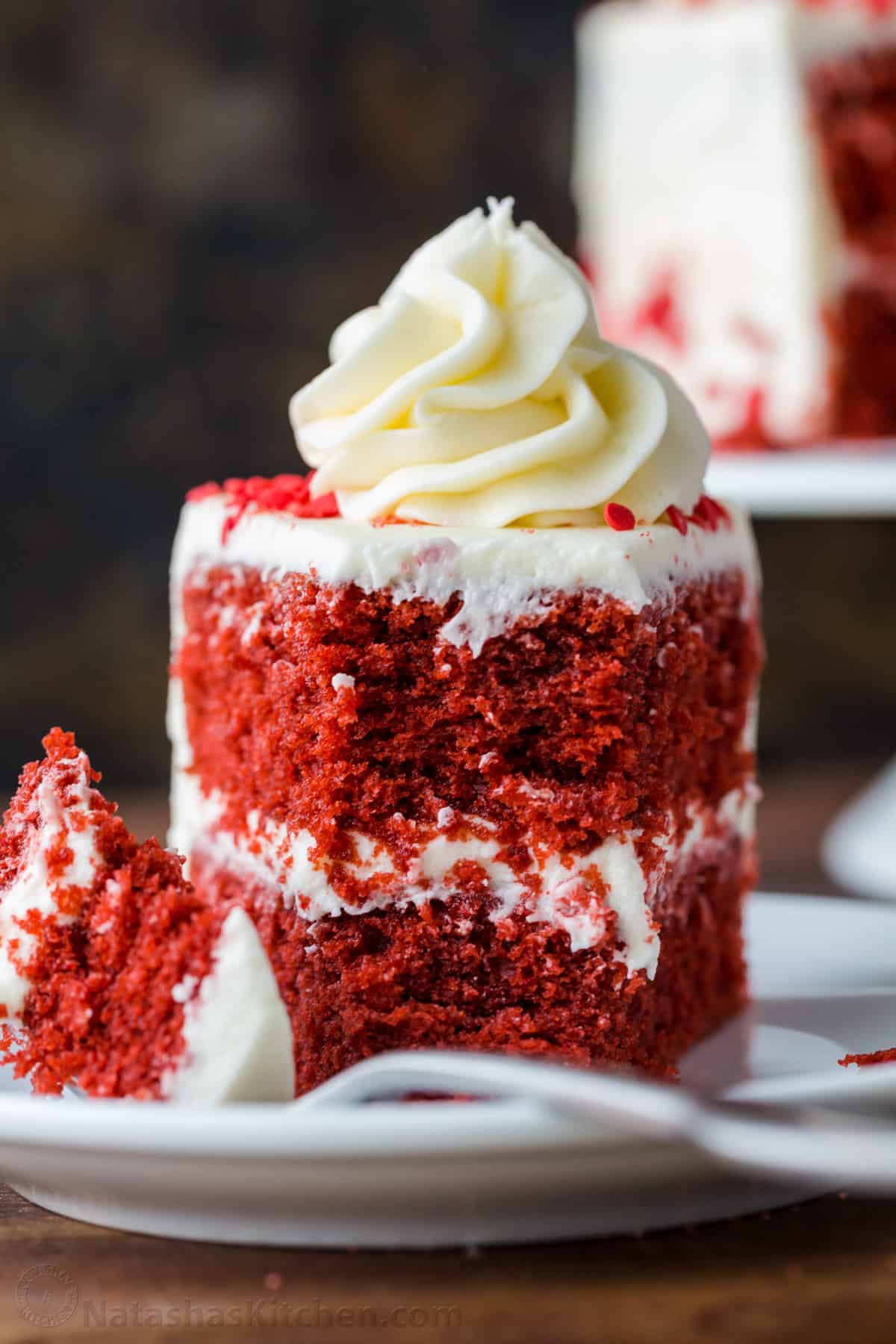 Up close slice of red velvet cake with fork