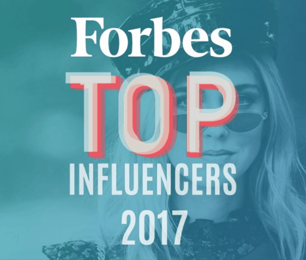 A close up of a sign that says Forbes top influencers 2017